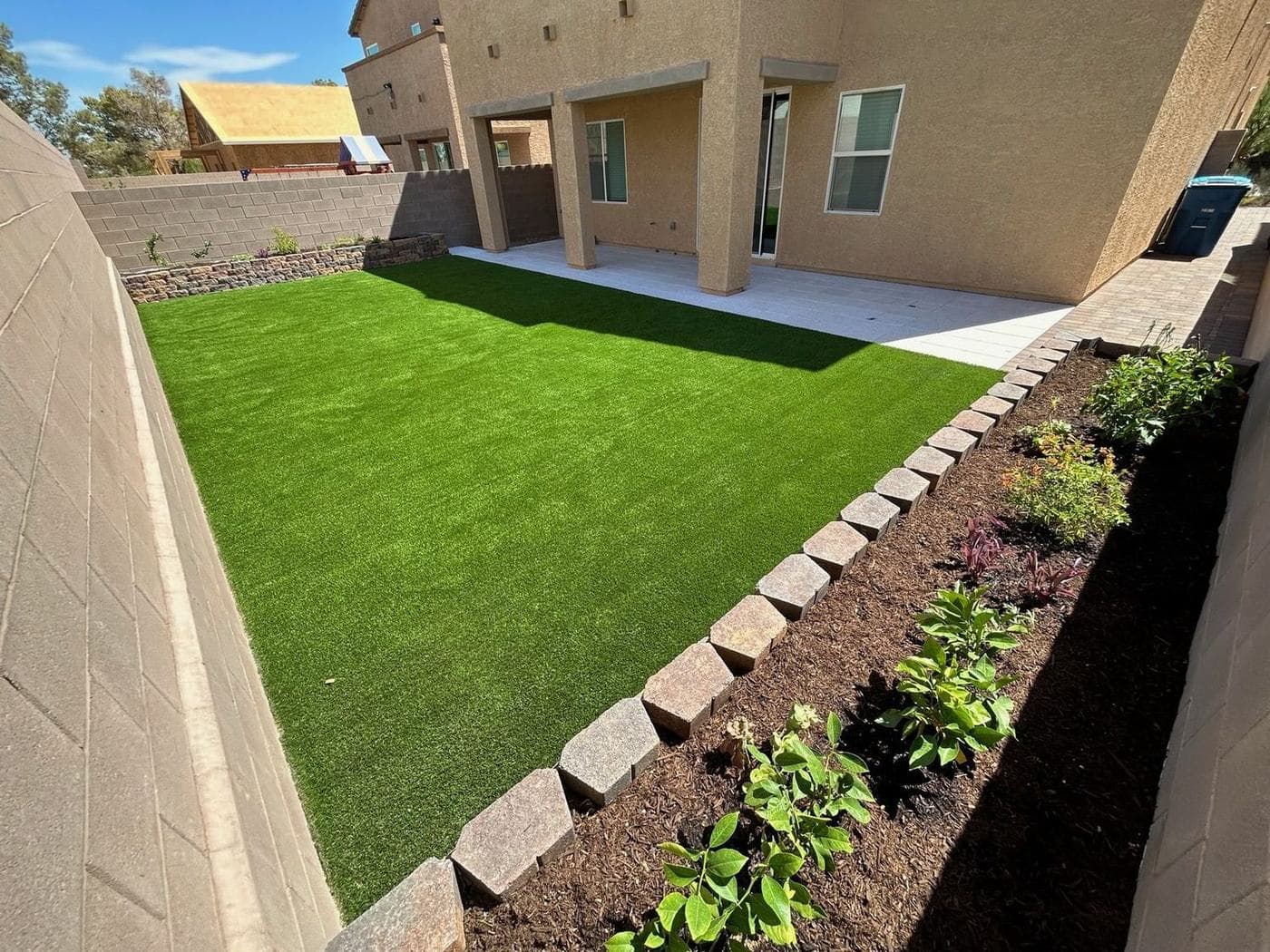 Dirt yard to finished landscape — after